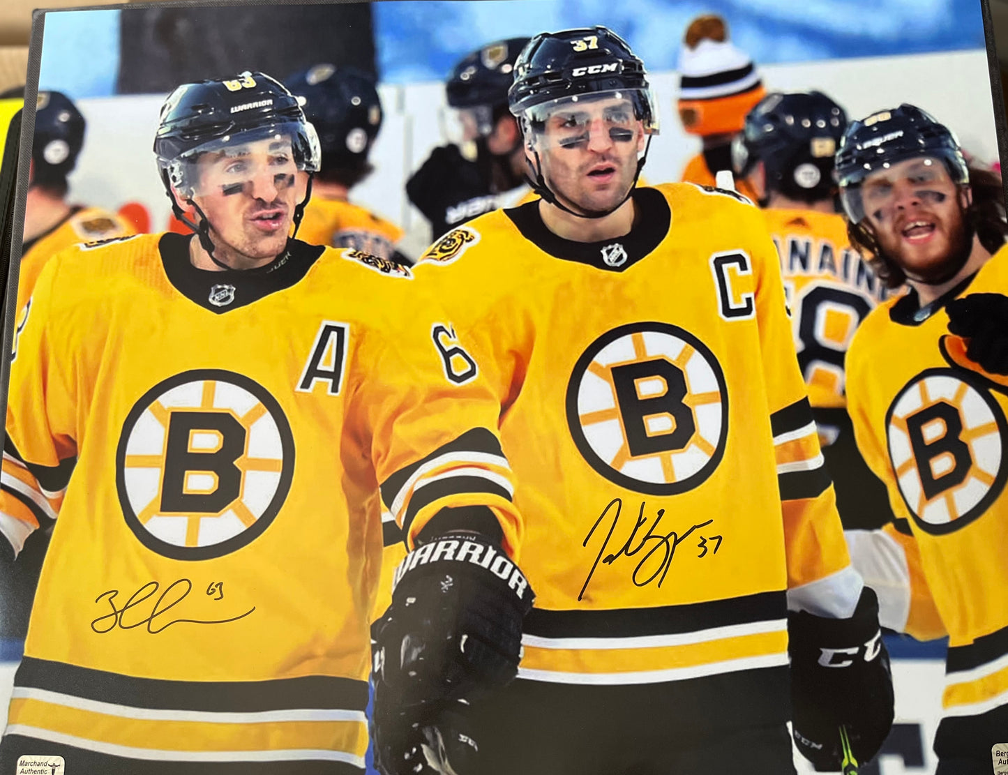Bruins Patrice Bergeron and Brad Marchand dual signed 16x20